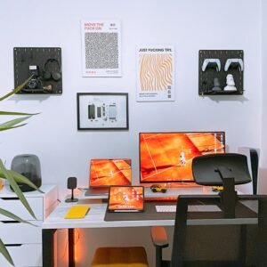 a desk with two monitors and a keyboard